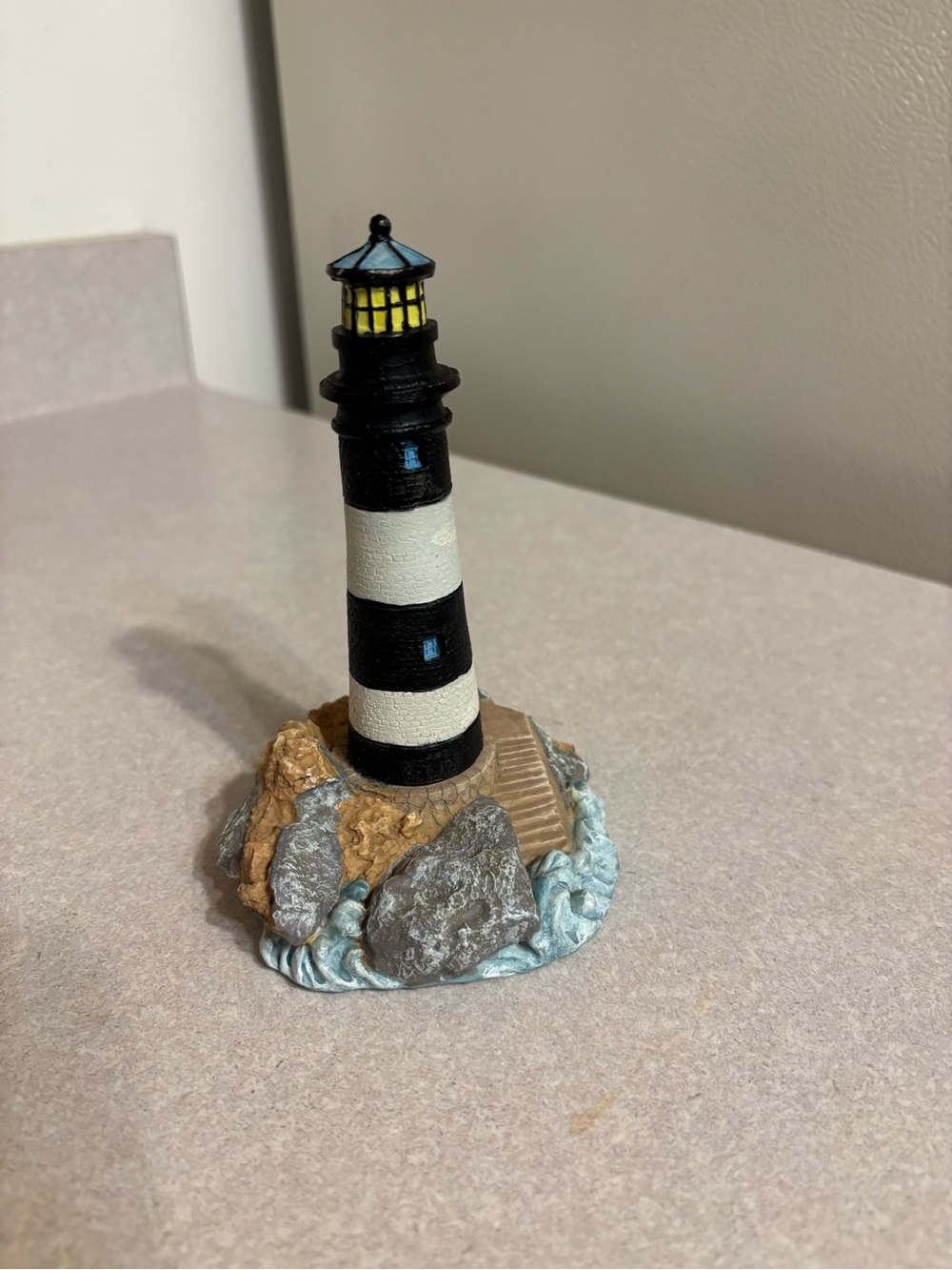 Striped Black & White Lighthouse Figurine with Rocky Base